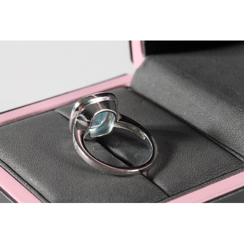 116 - 18ct white gold cocktail ring with square cut light blue stone encircled by diamond chips and also p... 