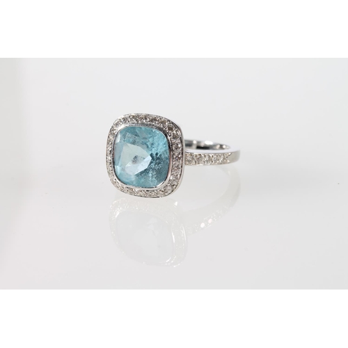 116 - 18ct white gold cocktail ring with square cut light blue stone encircled by diamond chips and also p... 