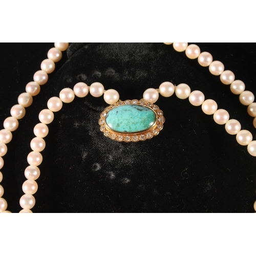 117 - Double strand of pearls choker necklace with yellow metal clasp set with turquoise cabochon surround... 