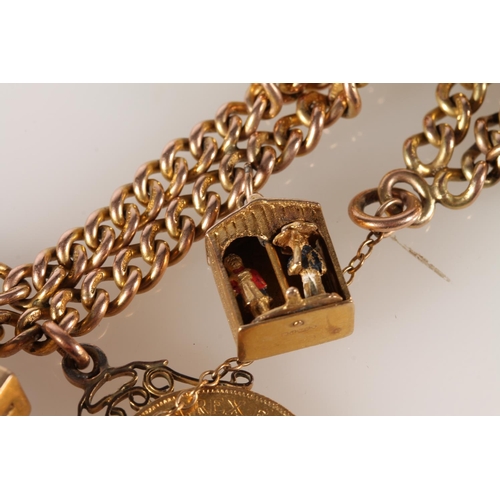 118 - 9ct gold charm bracelet with quantity of charms, including a sovereign and half sovereign, 57g gross... 