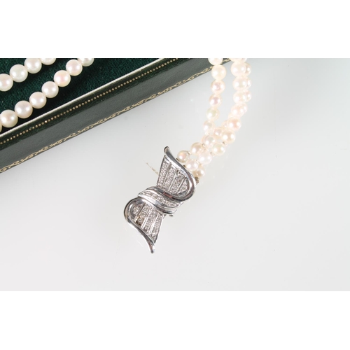 130 - Three strand cultured pearl necklace with 18ct white gold stylized box clasp with chip diamonds, 45c... 