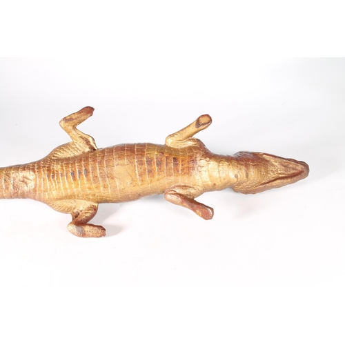 373 - Painted cast bronze figure of crocodile, 73cm.