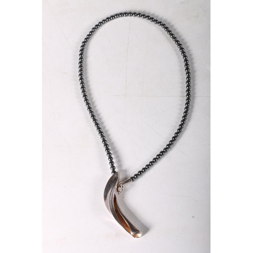 246 - Georg Jensen hematite bead necklace with silver pendant also inscribed HaH, 42cm,