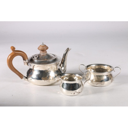 82 - Edward VII Scottish silver plain circular bachelors tea set, three pieces including teapot, 10cm, wi... 