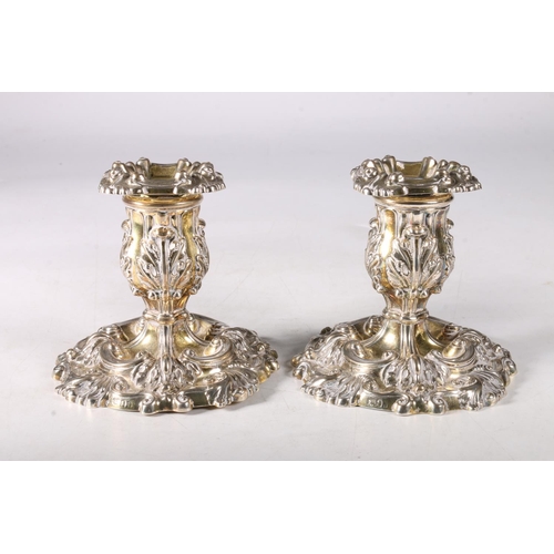 84 - Pair of George IV cast silver gilt desk candlesticks, of rococo form, maker hallmarked John Watson, ... 