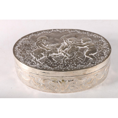 87 - A late 19th century Dutch silver oval box, the chased cover decorated with three cherubs and goat, 1... 