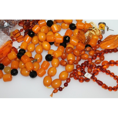 225 - Strand of faux butterscotch amber beads, an amber pendant on necklace, raw amber, earrings, etc.