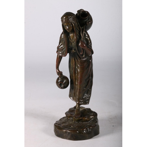 360 - A bronze water carrier, signed Besserdich (1858-1915)In the form of a female figure carrying amphora... 