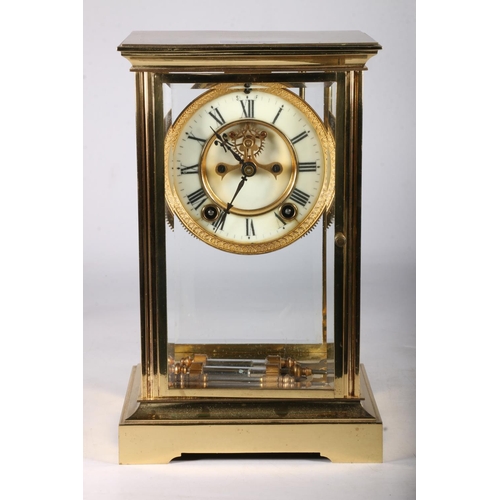 379 - French brass four glass mantel clock circa early 20th century with twin train movement striking on a... 