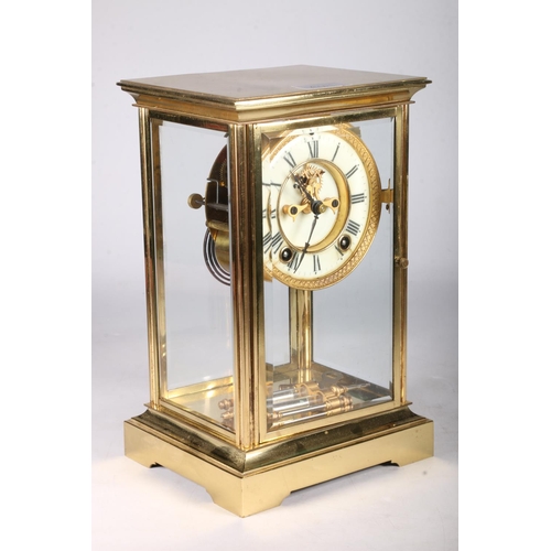 379 - French brass four glass mantel clock circa early 20th century with twin train movement striking on a... 