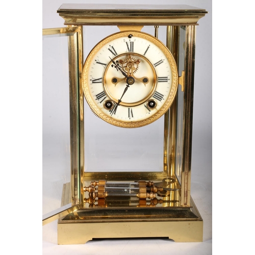 379 - French brass four glass mantel clock circa early 20th century with twin train movement striking on a... 