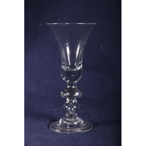 421 - 18th Century heavy baluster wine glass, trumpet bowl, double knop and folded foot, 21cm.