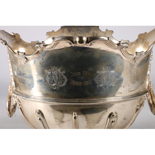 81 - Edwardian silver rose bowl, having a Monteith style shaped edge with moulded decoration, on socle ba... 