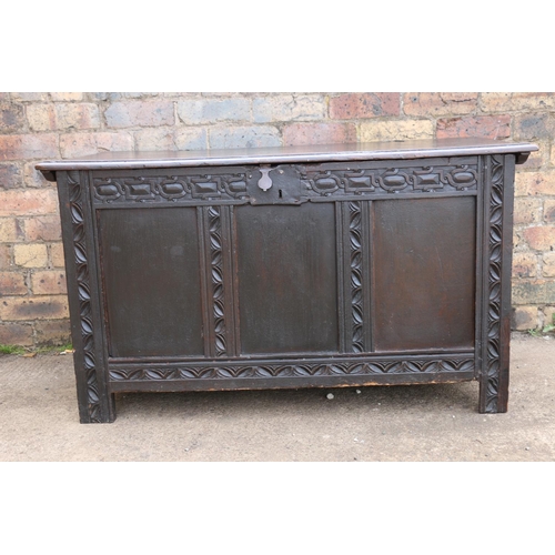 547 - 19th century chip carved oak hinge top blanket box with triple fielded panel front, raised on straig... 