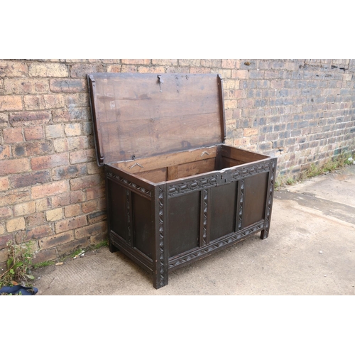 547 - 19th century chip carved oak hinge top blanket box with triple fielded panel front, raised on straig... 