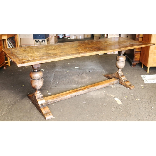 550 - Antique oak refectory table of typical form, raised on trestle end base with baluster supports unite... 