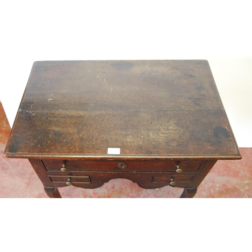 340 - George III oak lowboy with a long drawer above two short drawers and a shaped apron, on cabriole leg... 