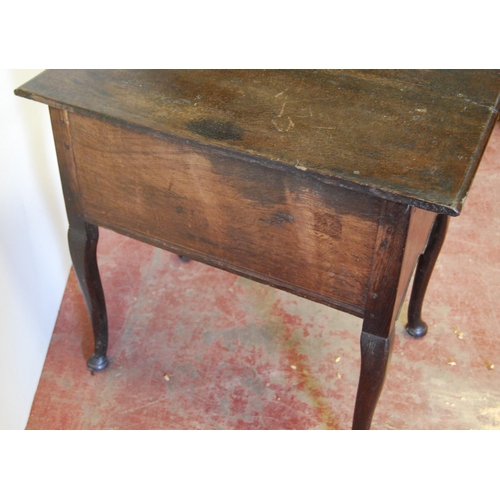 340 - George III oak lowboy with a long drawer above two short drawers and a shaped apron, on cabriole leg... 