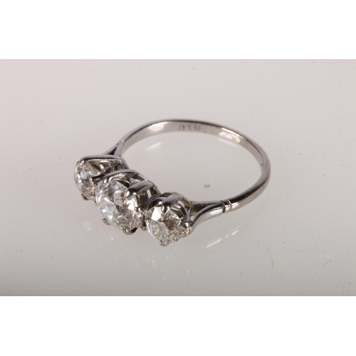 105 - 18ct white gold ring with central round cut diamond, approximately 1ct, flanked by two diamonds, app... 