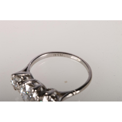 105 - 18ct white gold ring with central round cut diamond, approximately 1ct, flanked by two diamonds, app... 