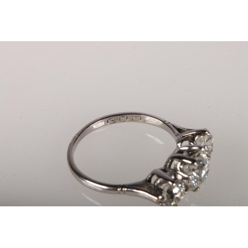 105 - 18ct white gold ring with central round cut diamond, approximately 1ct, flanked by two diamonds, app... 