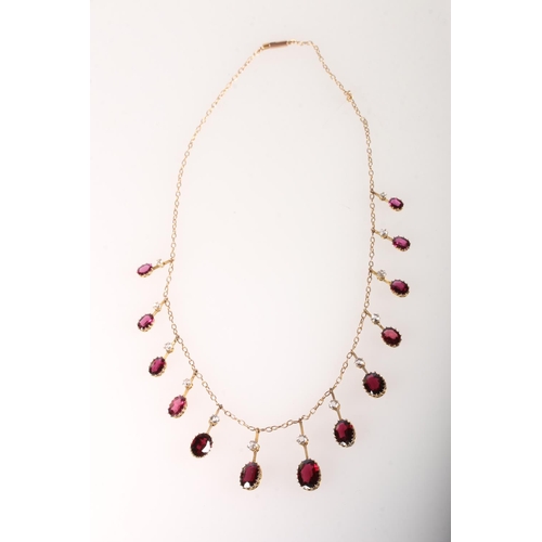 107 - Yellow metal stone set necklace with thirteen oval shaped fine garnets and white sapphires, 16c... 