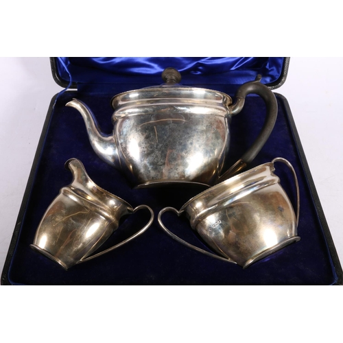 14 - George V silver three part tea set, hallmarked Martin, Hall & Co, Sheffield 1911, retailed ... 