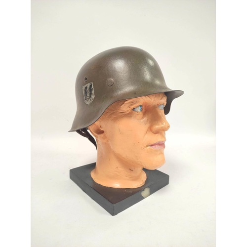 212 - German Third Reich. M1935 stahlhelm with Waffen S.S runic shield (first type) to right side and fini... 