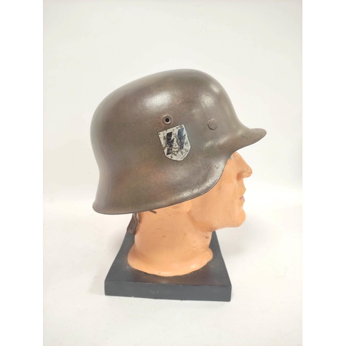 212 - German Third Reich. M1935 stahlhelm with Waffen S.S runic shield (first type) to right side and fini... 