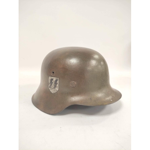 212 - German Third Reich. M1935 stahlhelm with Waffen S.S runic shield (first type) to right side and fini... 