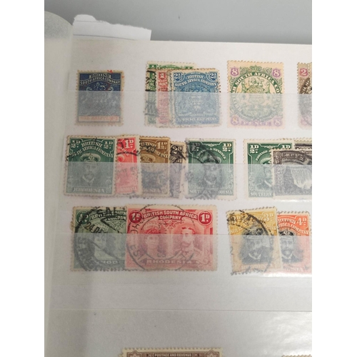 237 - Africa. Four collector's stamp albums with issues from Botswana, The Gold Coast, Southern Rhodesia, ... 