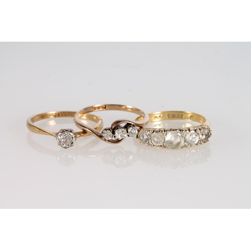 143 - 18ct gold and platinum solitaire dress ring, size L/M, 1.9g, an 18ct gold diamond three-stone ring, ... 