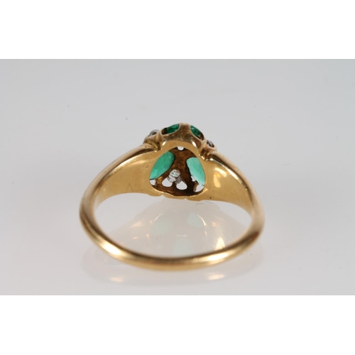 178 - 19th c. or earlier yellow metal ring with three green pear shaped cut stones separated by diamond, s... 