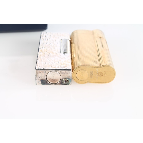 181 - Dunhill rollagas lighter with textured exterior, marked Made in Switzerland, with original box, and ... 