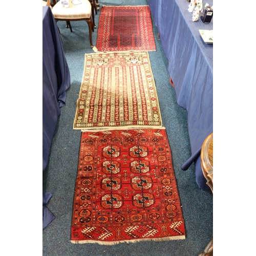 558 - Baluchistan prayer rug, 135 x 77, another worn Baluchistan, and a Turkoman style mat with eight guls... 