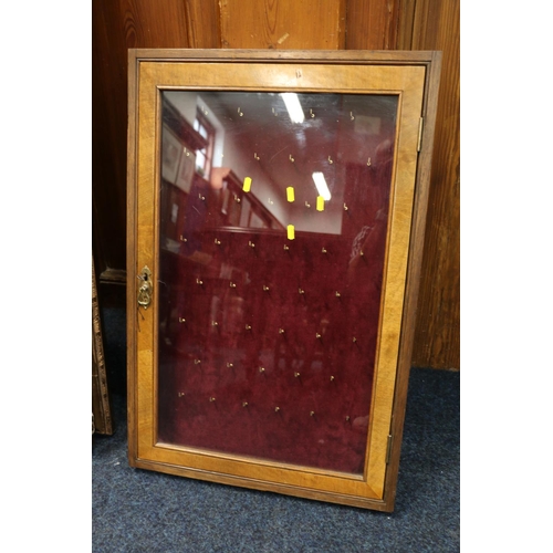 565 - Antique satinwood and oak wall cabinet with pocket watch hooks to the interior, 78cm x 52cm.