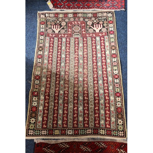 558 - Baluchistan prayer rug, 135 x 77, another worn Baluchistan, and a Turkoman style mat with eight guls... 