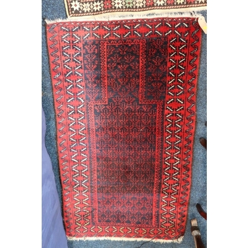 558 - Baluchistan prayer rug, 135 x 77, another worn Baluchistan, and a Turkoman style mat with eight guls... 