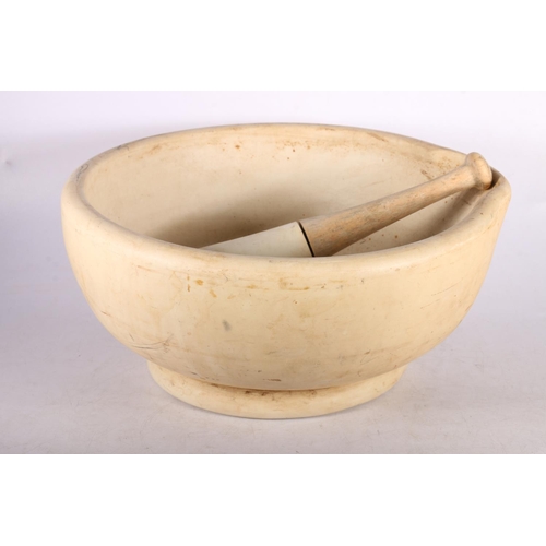 406 - Large chemists footed mortar and pestle with wooden handle, 36 diameter.