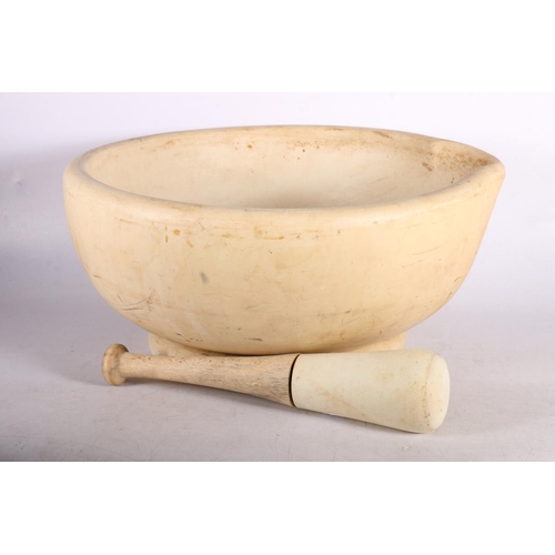 406 - Large chemists footed mortar and pestle with wooden handle, 36 diameter.