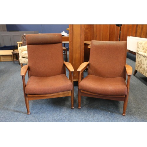 546 - Two mid-20th century teak framed lounge armchairs in the manner of a Guy Rogers Manhattan recliner c... 