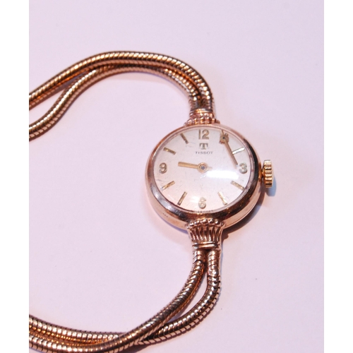 132 - Tissot lady's 9ct gold bracelet watch, 13.5g without movement.