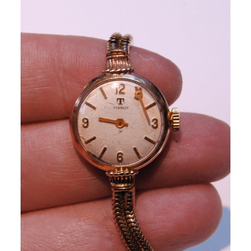 132 - Tissot lady's 9ct gold bracelet watch, 13.5g without movement.