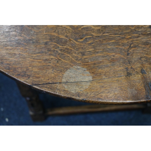 50A - English Oak metamorphic Monks chair with rectangular seat and circular table on carved and turned su... 