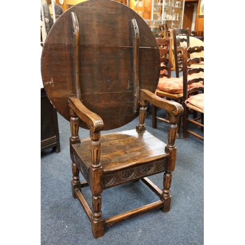 50A - English Oak metamorphic Monks chair with rectangular seat and circular table on carved and turned su... 