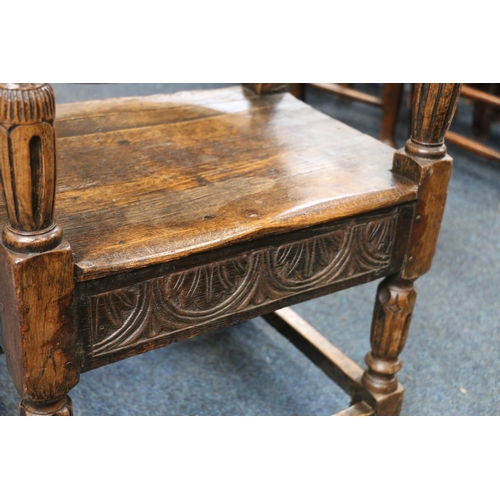 50A - English Oak metamorphic Monks chair with rectangular seat and circular table on carved and turned su... 