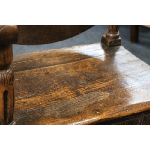 50A - English Oak metamorphic Monks chair with rectangular seat and circular table on carved and turned su... 