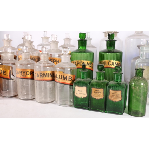 70A - Collection of thirty three glass apothecary bottles, including green, Bristol blue, brown , clear, s... 