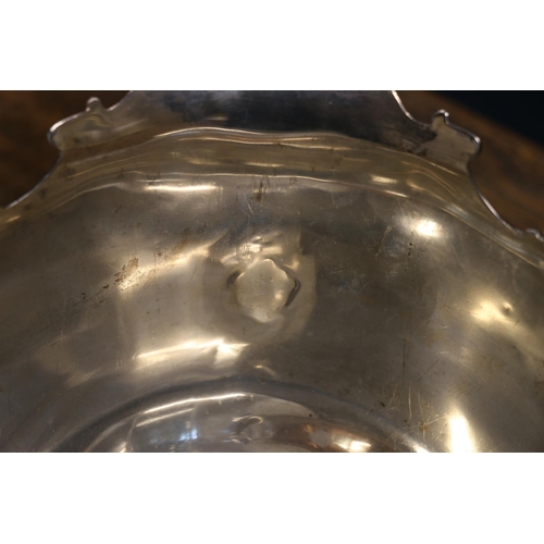 81 - Edwardian silver rose bowl, having a Monteith style shaped edge with moulded decoration, on socle ba... 