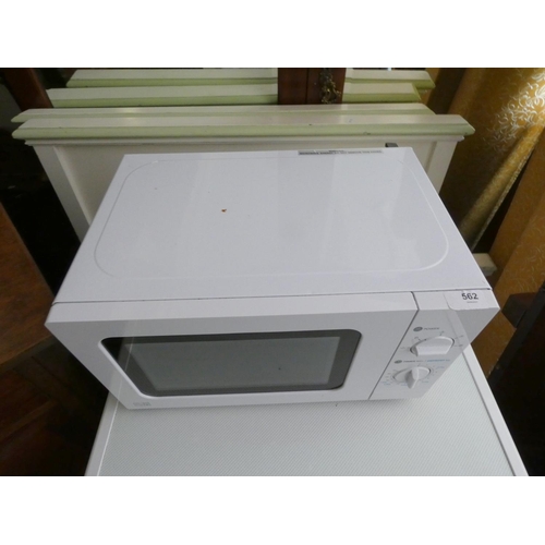 562 - Small white microwave.